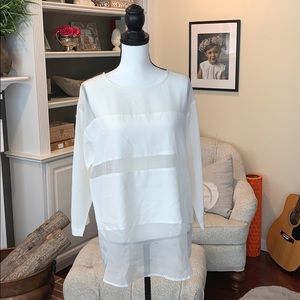 Trina Turk cream blouse; sheer/solid panels; NWT